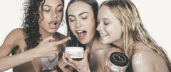 Girls with body cream on face and about to eat body cream