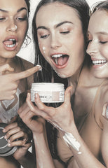 Girls with body cream on face and about to eat body cream