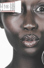 Girl holding lip duo scrub and balm tube