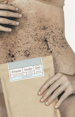 Girl holding coffee scrub packet