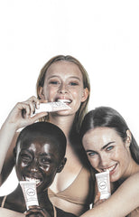 Girls holding frank body's complete face range