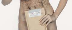 Girl holding coffee scrub packet